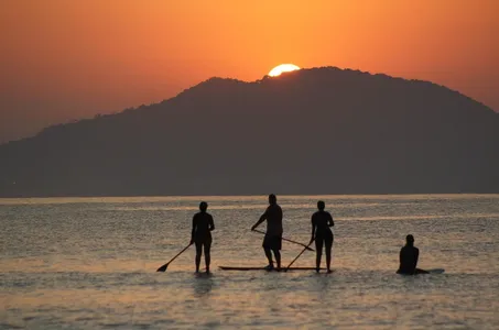 Fitness instructor Nikki Gregg, who paddles with her dog, Nui, says paddleboarding works every muscle. 